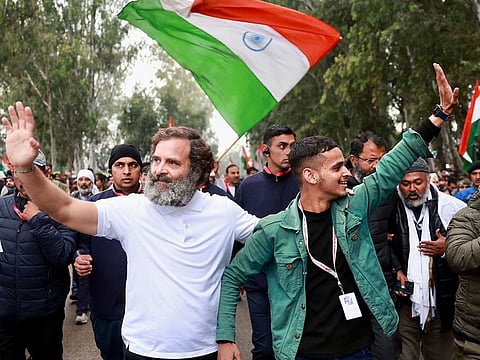 File photo: Indian National Congress leader Rahul Gandhi with a padayatri during the party's Bharat Jodo Yatra in Udhampur, Jammu and Kashmir on January 24, 2023. Traversing 12 states, the walk from the south to the north of India covered 3,500km over 150 days. It is scheduled to end with the unfurling of the Indian flag in Srinagar, Jammu and Kashmir, on January 30.