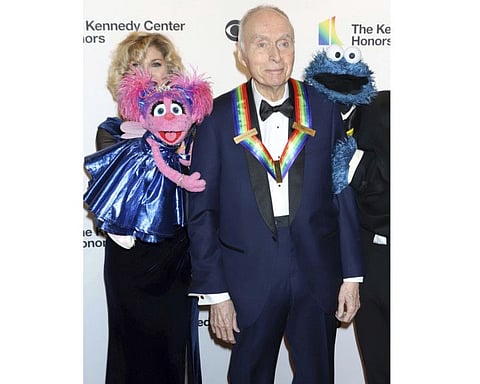 Honoree Lloyd Morrisett appears with muppet characters at the 42nd Annual Kennedy Center Honors at The Kennedy Center, Sunday, Dec. 8, 2019, in Washington. Morrisett, the co-creator of the beloved children's education TV series “Sesame Street,” which uses empathy and fuzzy monsters like Abby Cadabby, Elmo and Cookie Monster to charm and teach generations around the world, has died. He was 93. Morrisett’s death was announced Tuesday by Sesame Workshop, the nonprofit he helped establish under the name the Children’s Television Workshop. (Photo by Greg Allen/Invision/AP, File)