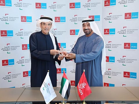 Sheikh Ahmed bin Saeed Al Maktoum, Chairman and Chief Executive of Emirates Airline and Group, and Zaki Anwar Nusseibeh, Cultural Advisor to the President of the UAE, Chancellor of the UAE exchange souvenirs at the ceremony in Au Dhabi.