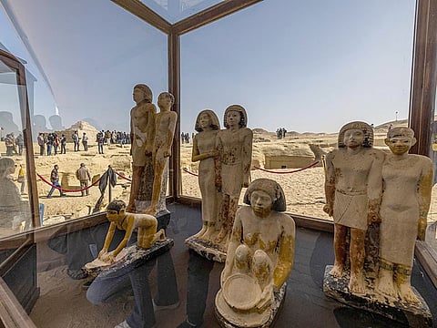 A collection of pharaoh statues is on display at the Saqqara necropolis, where a gold-laced mummy and four tombs including of an ancient king's "secret keeper" were discovered, south of Cairo on January 26, 2023.