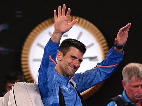 Serbia's Novak Djokovic waves as he leaves after his victory against Tommy Paul of the US in the semi-finals.
