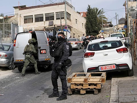 An Israeli policeman secures a shooting attack site in east Jerusalem, Saturday, January 28.