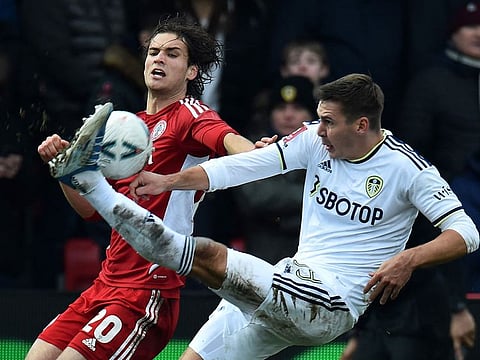 Accrington Stanley's Scottish striker Aaron Pressley (L) vies with Leeds United's Dutch midfielder Crysencio Summerville during the English FA Cup fourth round football match between Accrington Stanley and Leeds United at the Wham Stadium in Accrington, north west England on January 28, 2023