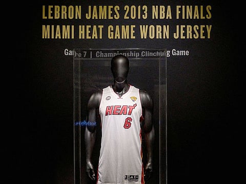 LeBron James’ game-worn jersey from the athlete’s NBA finals game 7 victory over the Miami Heat in 2013, is on display during a press preview at Sotheby's auction House in New York City.