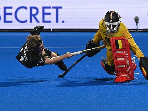 Germany's Thies Prinz (L) scores the goal past Belgium's goalkeeper Vincent Vanasch during penalty shootout at the FIH men's Hockey World Cup 2023 final match between Germany and Belgium at the Kalinga Stadium in Bhubaneswar