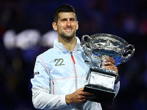 Serbia's Novak Djokovic holds the Australian Open trophy after winning his final match against Greece's Stefanos Tsitsipas.