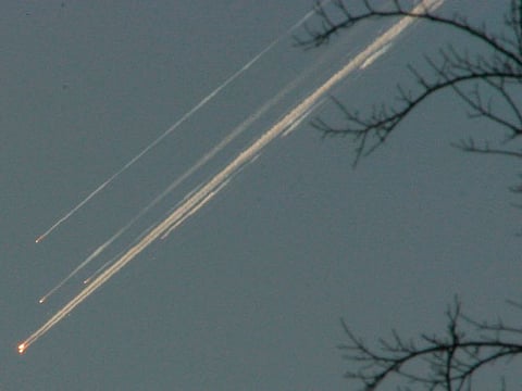 Debris from the space shuttle Columbia streaks across the Texas sky as seen from Dallas on Saturday, Feb. 1, 2003