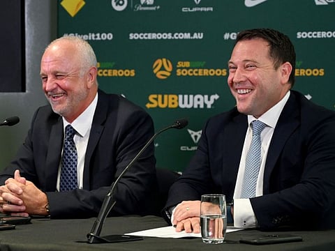 James Johnson CEO Football Australia (right) and Graham Arnold attend a press conference in Sydney announcing Arnold's decision to remain in charge of the team.