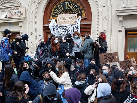 French high school students block the access to the Lycee Turgot in Paris during a nationwide day of strike and protests against French government's pension reform plan in France.