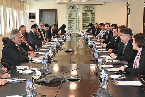 Pakistans Finance Minister Ishaq Dar (left) meeting with a International Monetary Fund (IMF) review mission led by Nathan Porter (second right) at the Finance Ministry in Islamabad.