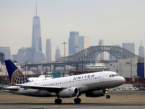 FILE PHOTO: A United Airlines passenger jet takes off with New York City as a backdrop, at Newark Liberty International Airport, New Jersey, U.S. December 6, 2019.
