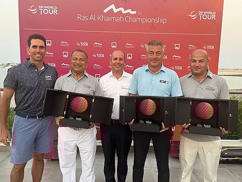 The winning Pro-Am Team in Wednesday's Ras Al Khaimah Championship captained by Rafa Cabrera Bello (left) with the prizes presented by Paul Booth (centre), General Manager, Al Hamra Golf Club, Ras Al Khaimah
