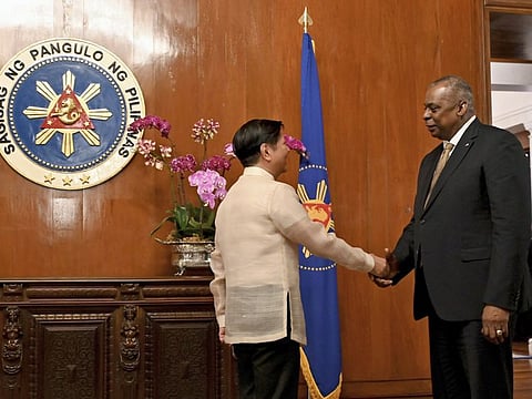 US Secretary of Defence Lloyd James Austin III, right, shake hands with Philippine President Ferdinand Marcos Jr. during a courtesy call at the Malacanang Palace in Manila, Philippines on Thursday, Feb. 2, 2023.