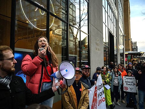 Members of the Alphabet Workers Union (CWA) hold a rally outside the Google office in response to recent layoffs, in New York.