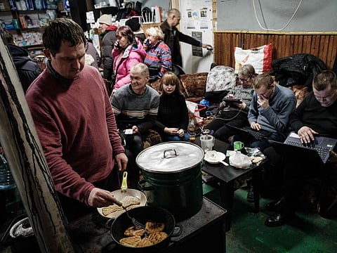Volunteer Ivan, 36, cooks for people at a humanitarian centre in Bakhmut on February 3, 2023.
