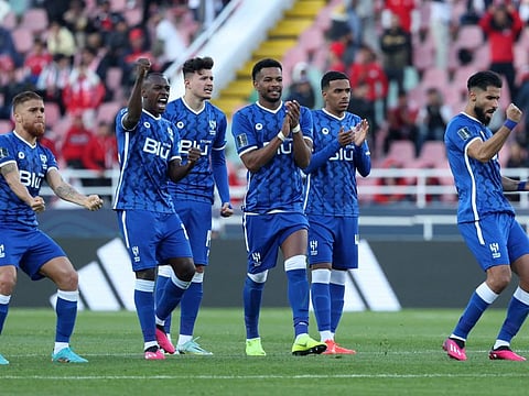 Al Hilal's players celebrate after winning the penalty shoot-out during the FIFA Club World Cup second round match against Morocco's Wydad AC at the Prince Moulay Abdellah Stadium in Rabat.