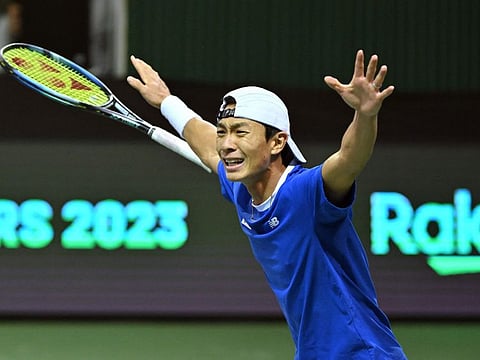 South Korea's Hong Seong-chan celebrates after defeating Belgium's Zizou Bergs during their singles match of the Davis Cup tennis qualifiers between South Korea and Belgium in Seoul.