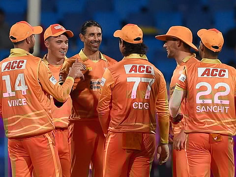 David Wiese (centre) of Gulf Giants celebrates with teammates after claiming a five-wicket haul against Sharjah Warriors at the Sharjah Cricket Stadium on Monday.