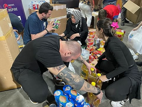 Residents at a warehouse in Dubai's Al Quoz, where the collection drive was being organised.