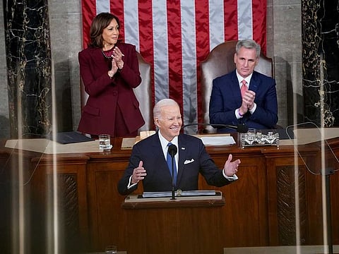 President Joe Biden, flanked by Vice President Kamala Harris and House Speaker Kevin McCarthy, delivers his State of the Union to a joint session of Congress on Tuesday.