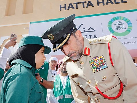 Lieutenant General Abdullah Khalifa Al Marri, Commander-in-Chief of Dubai Police, listens to a Hatta resident