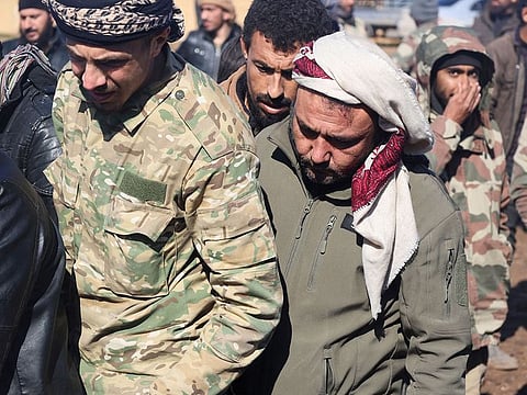 Naser al-Wakaa, a quake survivor, attends the funeral of some of his family members, in the aftermath of the earthquake, in rebel-held town of Jandaris, Syria February 7, 2023.