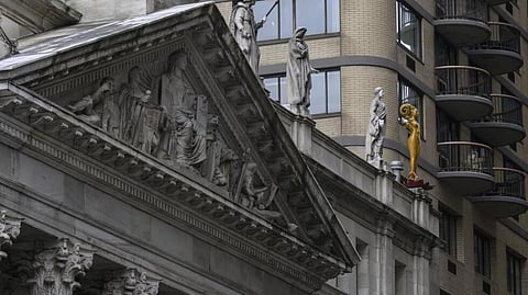 Shahzia Sikander’s sculpture “Now” (right) stands atop a New York courthouse as part of her multimedia exhibition “Havah... to breathe, air, life”.