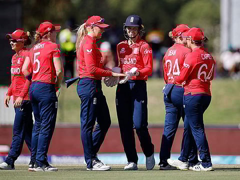 England's Amy Jones (3rd R) celebrates with teammates after the dismissal of West Indies' Shemaine Campbelle (not seen) during the Group B T20 women's World Cup cricket match between West Indies and England at Boland Park in Paarl on February 11, 2023.