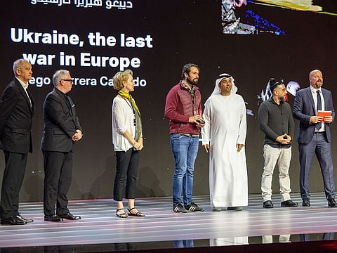 (Fourth from left) Spanish photojournalist and videographer Diego Herrera Carcedo receiving the top award at the Independent Freelance Photojournalist Awards (IFPA) ceremony held at the Xposure International Photography Festival on Friday.