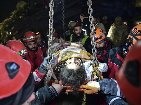 Rescue teams use a crane to rescue Nur Bayraktar in Kahramanmaras, southern Turkey.
