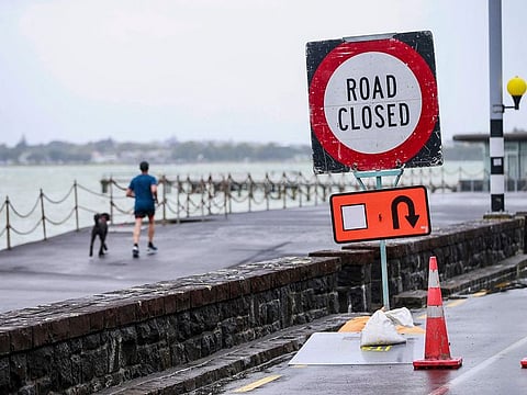 Road closure signs are placed along the waterfront in Auckland, New Zealand