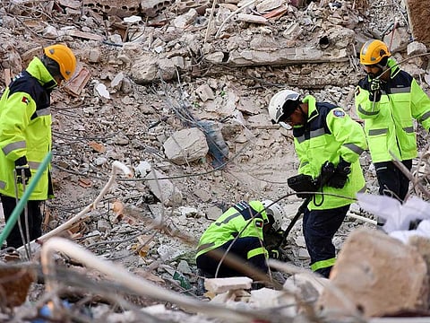 Emirati rescuers continue their search and rescue operations in the town of Jableh in the province of Latakia, northwest of the Syrian capital, on February 12 2023, in the aftermath of a deadly earthquake.