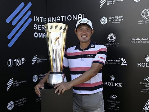 Winner of the International Series - Oman, Takumi Kanaya (Japan) with the tournament trophy