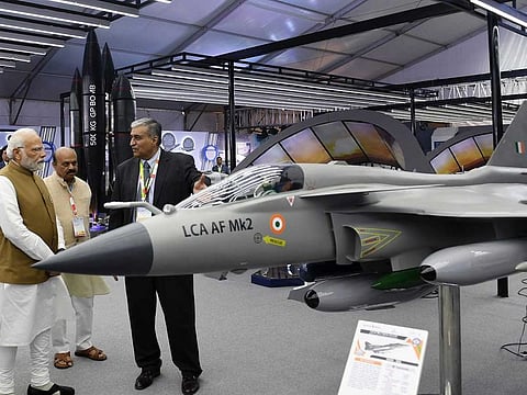 Prime Minister Narendra Modi viewing the LCA `Tejas’ Mk2 model during the 14th edition of the Aero India 2023 exhibition, in Bengaluru on Monday. Feb 13, 2023. State Chief Minister Basavaraj Bommai also seen.