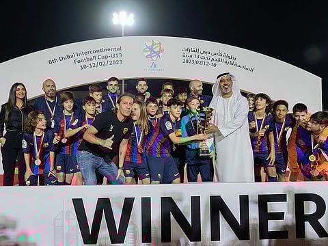 The Barcelona U-13 team were presented the trophy by former Real Madrid star Michel Salgado and Ahmed Salem Al-Mahri, Director of the Sports Development Dept. in DSC.