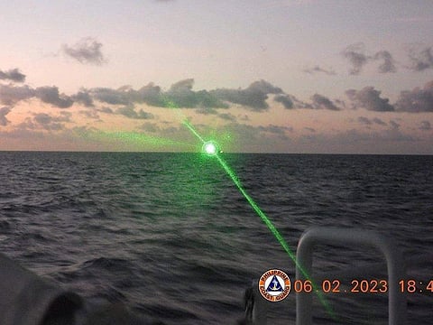 A green military-grade laser light from a Chinese coast guard ship in the disputed South China Sea