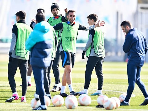 Barcelona's Uruguayan defender Ronald Araujo (centre) and teammates attend a training session on the eve of their UEFA Europa League play-offs football match against Manchester United at the Joan Gamper training ground in Sant Joan Despi, near Barcelona.