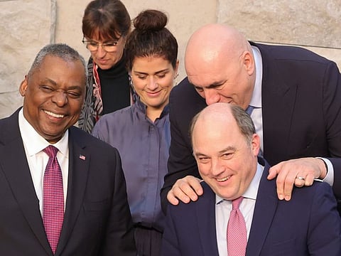 United States Secretary of Defence Lloyd Austin, Portugal's Defense Minister Helena Carreiras, Iceland's Defence Minister Thordis Kolbrun Reykfjord Gylfadottir, British Defence Secretary Ben Wallace and Italy's Defence Minister Guido Crosetto, from left to top right, laugh during a group photo of NATO defence ministers at NATO headquarters in Brussels, Wednesday, Feb. 15, 2023.