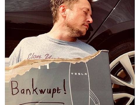 Tesla CEO Elon Musk posted this photo of himself holding a cardboard with "Bankwupt" written on it on his Twitter account. This playfulness is juxtaposed with his serious use of first principles approach to problem solving, which is perhaps his best-known secret.