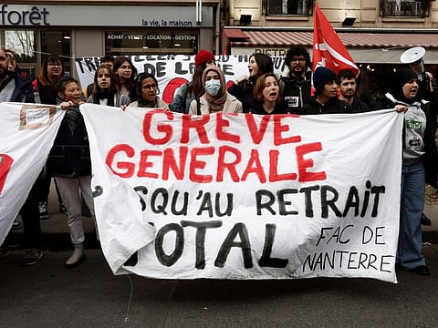 Students of Nanterre University attend a demonstration against French government's pension reform plan in Paris as part of the fifth day of national strike and protests in France, February 16, 2023. The placard reads "General strike until total withdrawal ".