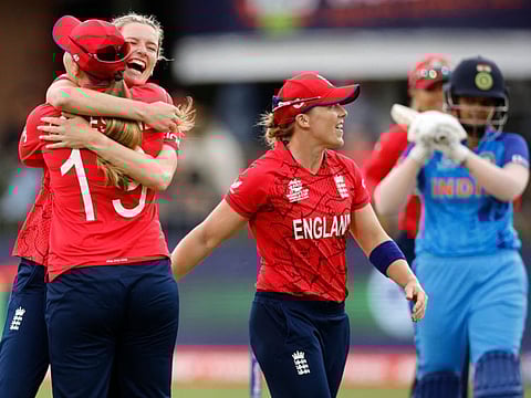 England's Lauren Bell (left) celebrates with teammates after the dismissal of India's Shafali Verma (right) during the Group B T20 women's World Cup cricket match at St George's Park in Gqeberha.