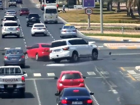 Screen grab from a video released by the Abu Dhabi Police showing hazards of using mobile phones while driving