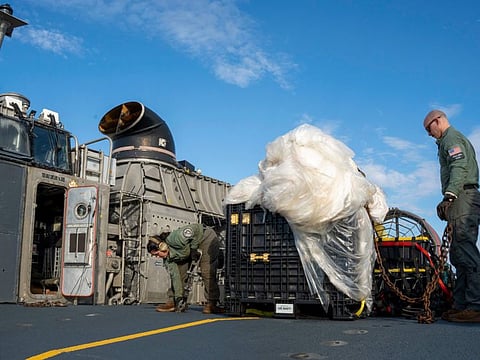 US Navy, sailors prepare material recovered off the coast of Myrtle Beach in the Atlantic Ocean from the shooting down of a Chinese high-altitude balloon, for transport to the FBI, at Joint Expeditionary Base Little Creek in Virginia Beach.