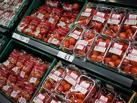 Tomatoes are displayed for sale inside a supermarket in London, Britain.