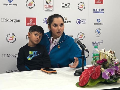 Indian ace Sania Mirza with her son Izhaan Mirza Malik during the press conference after losing in the first round.