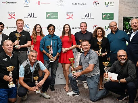 Winners and the presentation party of the previous event at Abu Dhabi Golf Club on The Senior Champions Tour with co-founder and organiser Vijay Vasu (right)