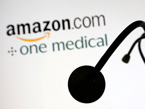 FILE PHOTO: A stethoscope is placed on displayed Amazon.com and One Medical logos in this illustration taken July 26, 2022.