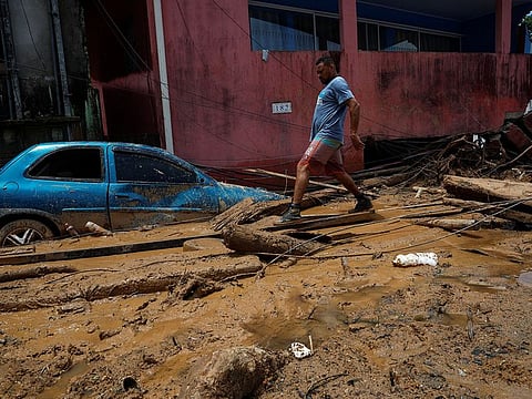 A man walks at one of the landslide sites after severe rainfall at Barra do Sahy, in Sao Sebastiao, Brazil.