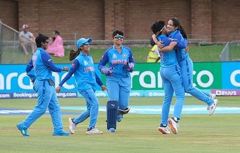 India's Renuka Singh Thakur (right) celebrates with teammates after the dismissal of Ireland's Orla Prendergast during the Group B T20 women's World Cup match at St George's Park in Gqeberha. India face Australia tomorrow.