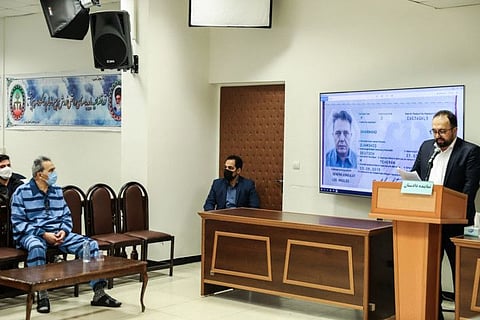 In this file photo taken on February 6, 2022, Jamshid Sharmahd (left front), who is accused by the Iranian government of being a leader of the US-based "Tondar terrorist group" behind a deadly attack in Iran in 2008, attends the first hearing of his trial in Tehran.